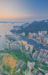Landscape from top view see the Floating House and local boat around Aberdeen bay estuary with Buildings at southern of Hong Kong