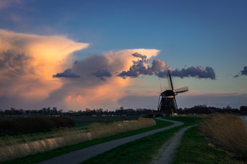 Dutch windmill with storm clouds in the background near the town of Zevenhuizen, close to Rotterdam, Netherlands