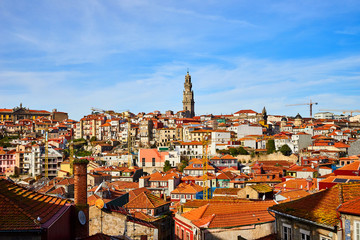 Stunning panoramic aerial view of traditional historic buildings in Porto. Vintage houses with red tile roofs. Famous touristic place and travel destination in  Portugal