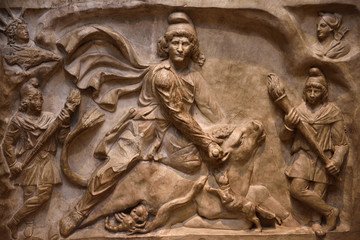 Marble relief carving of the God Mithras slaying the mystic bull second century Rome at ROM Toronto