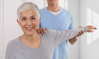 Woman having chiropractic back adjustment. Osteopathy, Physiotherapy, Injury rehabilitation concept - obrazy, fototapety, plakaty