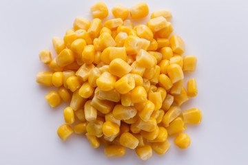 Canned corn on a white acrylic background
