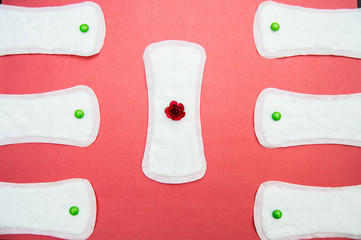 women's sanitary pads on pink background