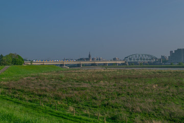 Fototapeta na wymiar Dutch passenger train passing a bridge