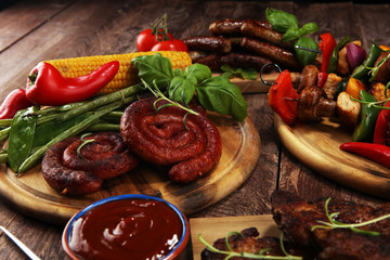Assorted delicious grilled meat and skewer with vegetable on rustic table