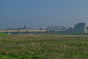 Dutch passenger train passing a bridge