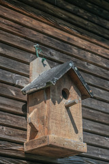 Wooden Birdhouse on wooden wall