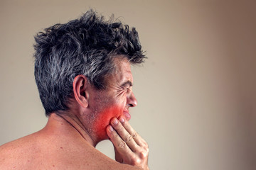 Naklejka premium Man feels strong tooth pain. People, healthcare and medicine concept