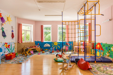 Colorful playroom in the kindergarten. Indoor play area