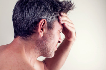 Fototapeta premium Man feels strong headache. People, healthcare and medicine concept