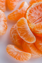 juicy mandarin on a white acrylic background