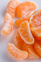 juicy mandarin on a white acrylic background