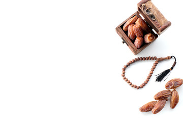 Ramadan concept. top view dates and rosary isolated on white background