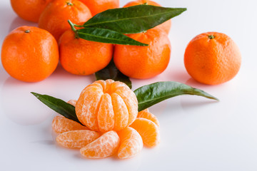 juicy mandarin on a white acrylic background
