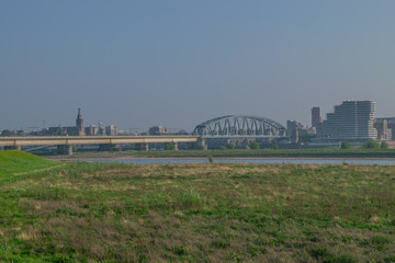 Dutch passenger train passing a bridge