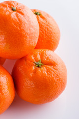 juicy mandarin on a white acrylic background