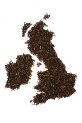 Loose black tea. The contour of the Great Britain is made from England breakfast tea isolated on white background, United Kingdom map.