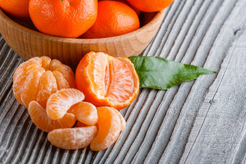 juicy mandarin on a gray wooden rustic background