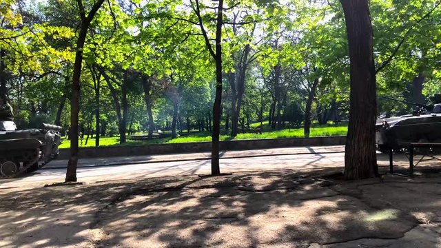 Infantry fighting vehicle rushes through the city Park