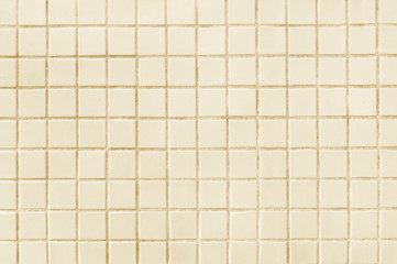 Old beige tile wall background texture