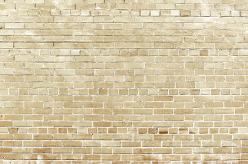 Old beige brick wall background texture