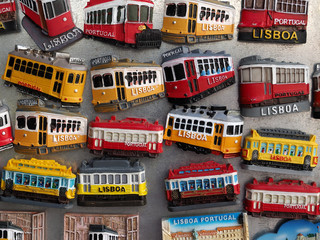 Colorful tram magnets in Lisbon on a board