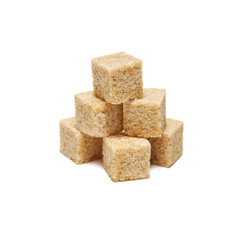 Brown cane sugar cubes isolated on white
