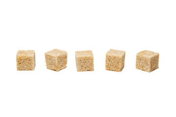 Brown cane sugar cubes isolated on white