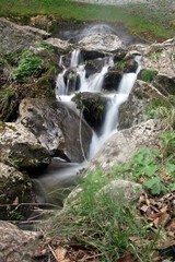 Waterfall in the mountains - water flow 