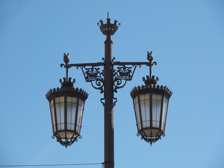 Fototapeta na wymiar Typical street lamp in Lisbon in front of blue sky