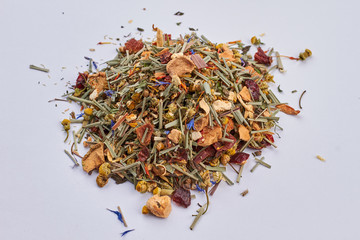 Heap of herbal tea close up. Mixed organic tea on white background. Healthy and delicious drink.