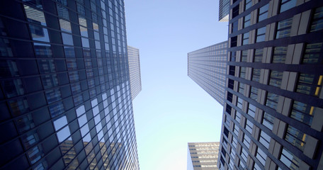 Obraz na płótnie Canvas Vertical View of Modern High Rise Skyscraper Office Buildings in Business Finance District