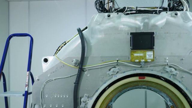 New hospital room improvement with tomograph being installed. An empty MRI, CT, PET scanner.MRI scanner without upper plastic covering panels. Building of new modern hospital with MR-imaging unit in