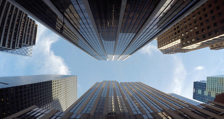 Fototapeta na wymiar Vertical View of Modern High Rise Skyscraper Office Buildings in Business Finance District