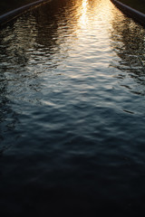 wonderful landscape texture of golden sunset on the surface of the river