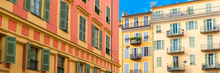 Fototapeta premium Nice, France, colorful facade, with typical windows and shutters 