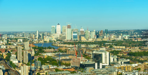 Panoramic view of office buildings in Canary Wharf at sunset