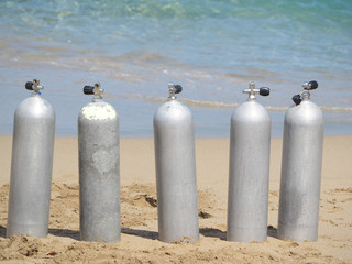 Naklejka premium compressed air cylinders for diving by the ocean.