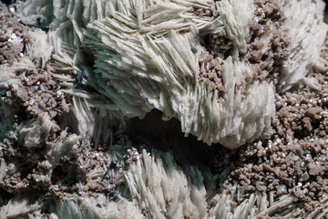 Raw cluster rough crystals close up in low light background