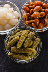 pickled vegetables on a dark stone background