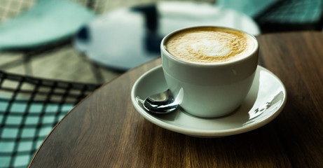 Coffee cup on a wooden table