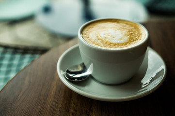 Coffee cup on a wooden table