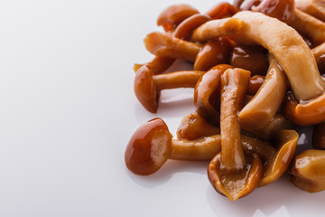 pickled vegetables on a white acrylic background