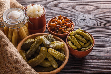pickled vegetables on a wooden rustic background