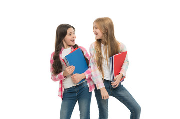 School stationery. Pupils carrying big textbooks to school classes. Taking extra classes. Girls...