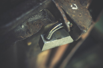 Old lock on the metal door.