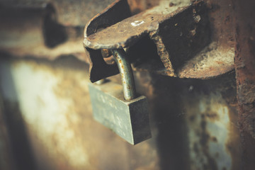 Old lock on the metal door.