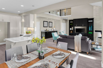 Kitchen, dining room, and living room in new home with open concept floor plan