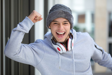Successful happy young latin man runner jogger sport sports cold winter joy pleasure