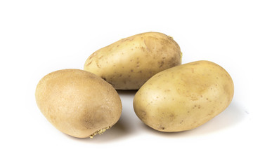 three isolated potatoes white background